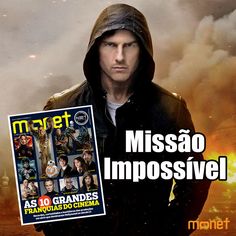 a man holding up a magazine cover in front of an image of a city fire