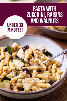 pasta with zucchini, raisins and walnuts in a bowl