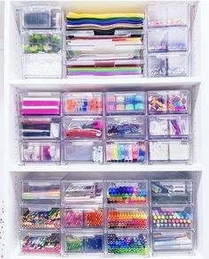 an organized closet with clear drawers and lots of crafting supplies