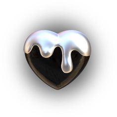 a black and white heart shaped object with liquid pouring out of it's center