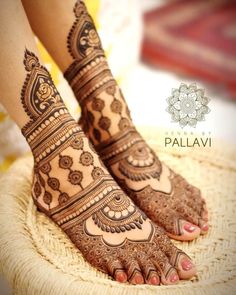 the feet are decorated with henna designs