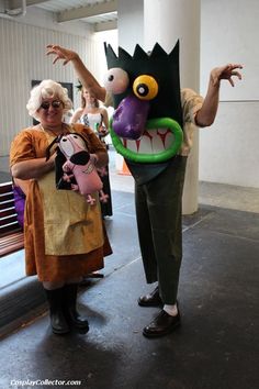 two people in costumes standing next to each other