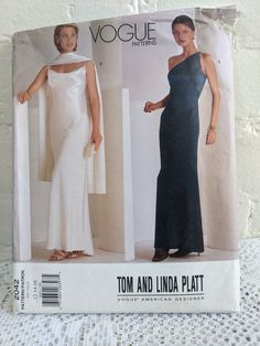 American Designer Series by Vogue from 2001.  CUT pattern in size 12 to 16.  Elegant evening wear dress formal, floor length.  Off the shoulder variation with scarf.  Tom and Linda Platt Designs. Close-fitting, slightly flared dress, floor length (back) and evening length (front), has binding and reverse side of fabric used as contrast for upper sections. A: self-lined upper sections, princess seams and side zipper. B: pullover, bias, and single layer scarf with reverse of fabric used as contras Fitted Dress Pattern, Long Fitted Dress, Evening Dress Sewing Patterns, Wedding Dress Sewing Patterns, Long Fitted Dresses, Evening Wear Dresses, Tail Dress, Vogue Dress, Timeless Dress