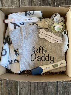 an open box with baby items in it
