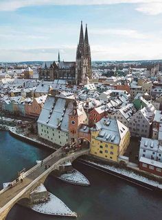 an aerial view of a city with snow on the ground