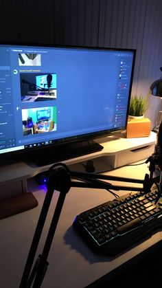 a computer monitor sitting on top of a desk with a keyboard and mouse next to it