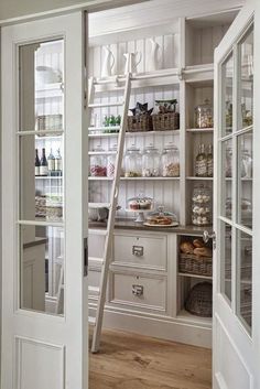 an open door leading to a pantry filled with food