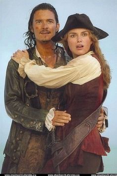 a man and woman dressed in pirate costumes