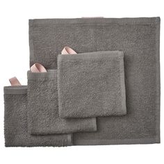 four pieces of grey towels with pink accents