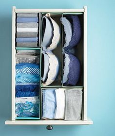 the instructions for how to use an open drawer with folded towels and socks in it