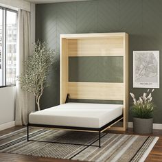 a bed with a wooden headboard and foot board in a room next to a window