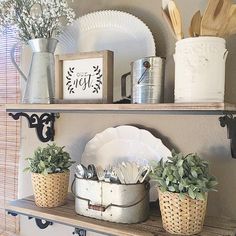 a shelf with pots, plates and utensils on it