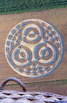 an aerial view of a crop circle in the middle of a field with two circles on it