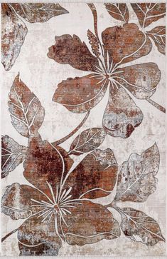an area rug with leaves and flowers on it