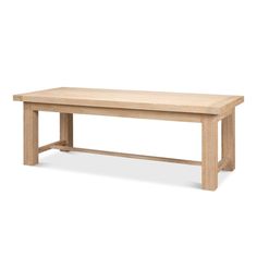 a wooden bench sitting on top of a white floor next to a table with two legs