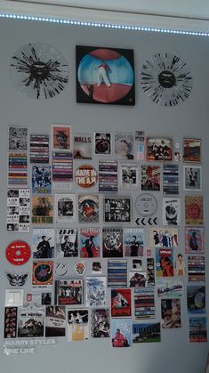 a wall covered in various stickers and pictures