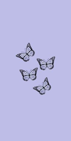 three butterflies flying in the sky on a purple background with space for text or image