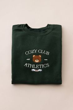 EXCLUSIVE Cozy Club Athletic Crewneck Sweater with embroidered design. Forest green crewneck sweatshirt with fleece lining. Unisex sizing. Size small - 40" bust Size medium - 44" bustSize large - 48" bust Size xl - 52" bust Crewneck Aesthetic, Minimal Shirt Design, Grunge Jacket, Girls Corset, Aesthetic Crewneck, Daisy Shorts, Bear Slippers, Green Crewneck, Puff Jacket