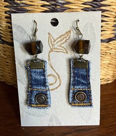 the earrings are made out of jeans and buttons