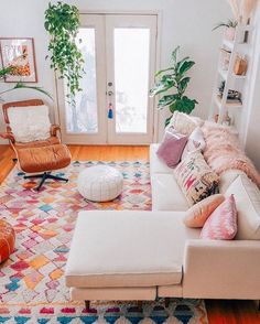 a living room filled with lots of furniture and decor