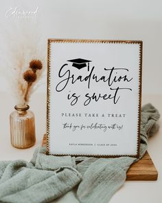 a graduation sign sitting on top of a table