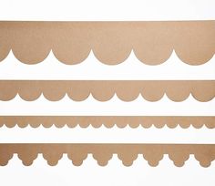 four pieces of cardboard with scalloped edges