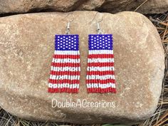 the american flag beaded earrings are made with red, white and blue seed beads