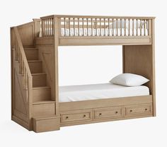 a bunk bed with drawers underneath it and a staircase leading to the upper floor area