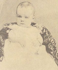 an old black and white photo of a baby