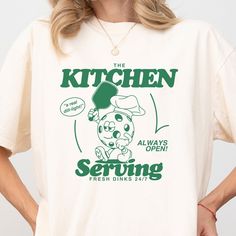 Are you a pickleball aficionado with a sense of humor as sharp as your serve? Look no further! Our "Serving Fresh Dinks" t-shirt is designed for players who live and breathe pickleball, offering not just comfort but a hefty dose of humor on the court. This isn't just any shirt; it's your new go-to gear for making a statement without saying a word. Features: Retro Vibes: With a design that throws it back to the golden days of sports fashion, this retro shirt is perfect for both on and off the cou Pickleball Shirt Design, Pickleball Graphic Design, Pickle Ball Shirt, Pickleball Branding, Marathon Shirt Design, Retro Tshirt Design, Pickleball Tournament, Pickleball Svg, Kitchen Shirts