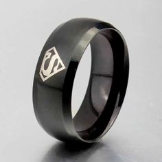 Black Superman 8mm Width Ring Size 14 Design Is Around The Ring 4 Times High Quality Titanium Metal Engagement, Wedding, Friendship, Love, Family, Gift Superman Ring, Rope Bracelet Men, Black Superman, Wolf Pendant Necklace, Titanium Metal, Wolves Pendants, Gold Skull, Titanium Ring, Round Pendant Necklace