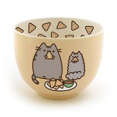 a bowl with an image of a cat eating food from a plate on the side