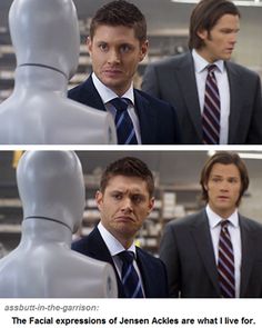 two men in suits and ties standing next to each other near a mannequin