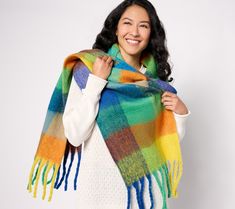 Offering versatile styling options, this fringed delight can be worn as a shawl or a scarf -- simply drape it over your shoulders or tie it around your neck. The oversized check pattern is a classic wintertime motif. From Sprigs. Shawl, Fringe Scarf, Check Pattern, Winter Time, Pattern