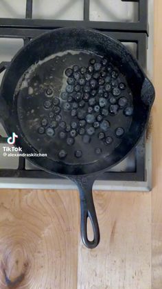a frying pan on top of a stove with water coming out of the bottom