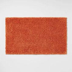 an orange rug on a white background