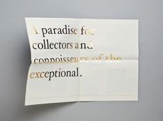 a piece of paper that has some type of writing on it with gold foil lettering