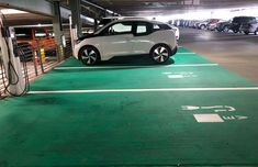 an electric car is parked in a parking garage