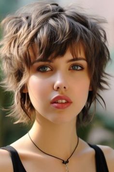 In this haircut the back and sides have grown out longer than the top. Shaggy Pixie With Bangs, Trendy Short Hair Styles 2024, Long On Top Pixie, Messy Medium Hairstyles, Mullet Shag Hairstyle Women, Thick Hair Pixie Cut, Feathered Fringe, Medium Shag Hairstyles, Pixie Mullet