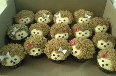 a box filled with cupcakes decorated like hedgehogs