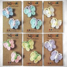 six small crocheted butterflies are shown in four different colors, each with the word win - ok written on them