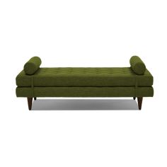 a green couch with two pillows on the back and one arm upholstered to it