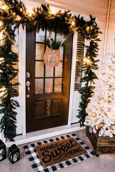 the front door is decorated with christmas decorations