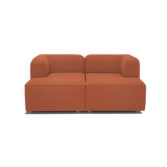 an orange couch sitting on top of a white floor