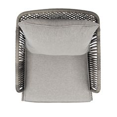 a grey chair with a pillow on it's back and the seat cushion folded up