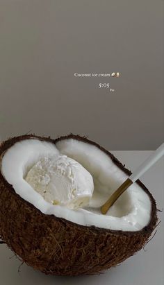 a coconut with some ice cream in it