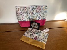 *Please note* The makeup in the photos is not included.  These lovely makeup bags are handmade from 100% cotton and closed with a Nylon coordinating zip and lined with 100% cotton and interfacing for stiffness. *The patten placement may vary from the photos. The wash bag has a waterproof ripstop lining. *Please note the ripstop lining may not be 100% waterproof due to the stitching. Size The boxed makeup bag and wash bag measure approximately 20cms wide by 15cms high and has a boxed bottom of 16 Sewing Kit Bag, Handmade Makeup Bag, Lovely Makeup, Mini Makeup Bag, Handmade Makeup, Cosmetic Brush, Small Makeup Bag, Mini Makeup, Small Makeup