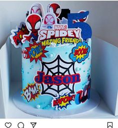 a spiderman themed birthday cake is on display