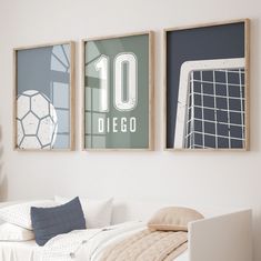 there are two framed pictures on the wall above a bed in this bedroom, one is soccer