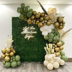 balloons and greenery on display at an event